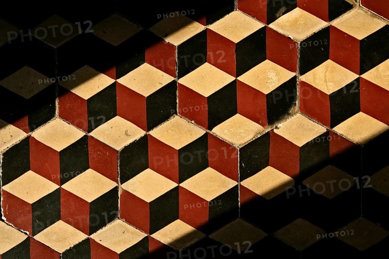 Old tile floor with mosaic pattern