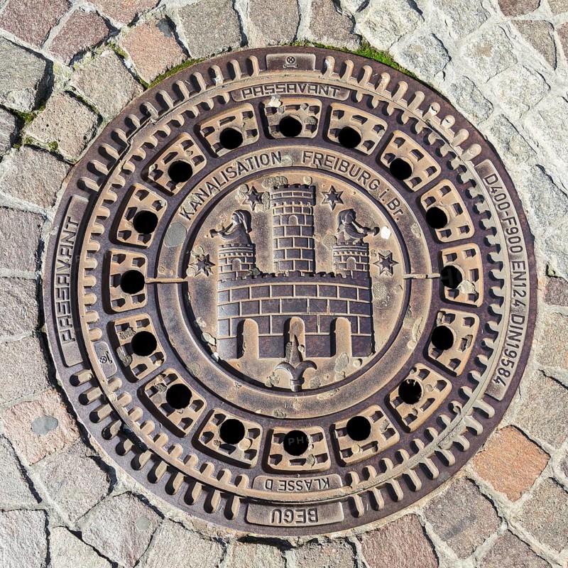 Manhole cover with coat of arms of the city of Freiburg im Breisgau