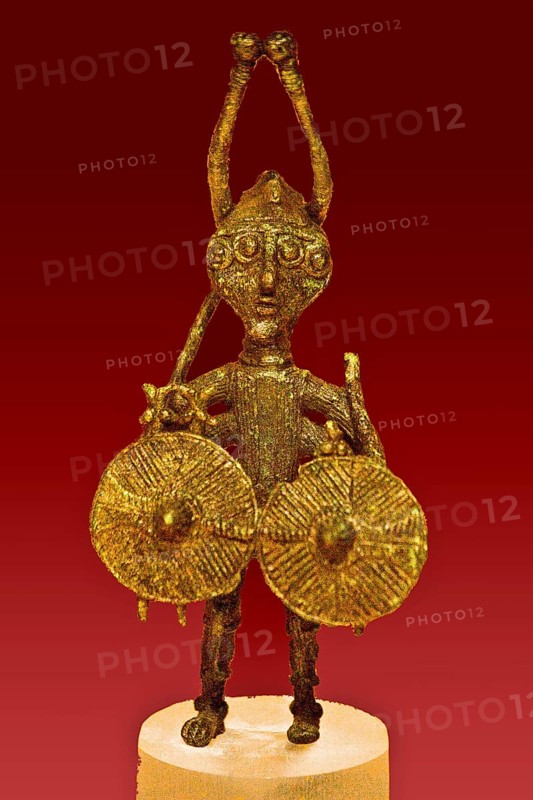Nuraghic bronze statuette of a demon with four eyes and four arms