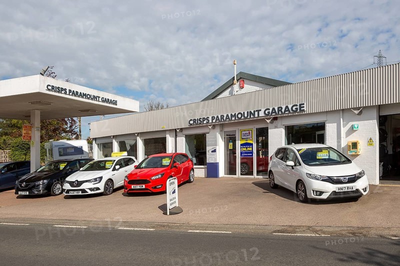 Second hand car sales on garage forecourt of motor dealership