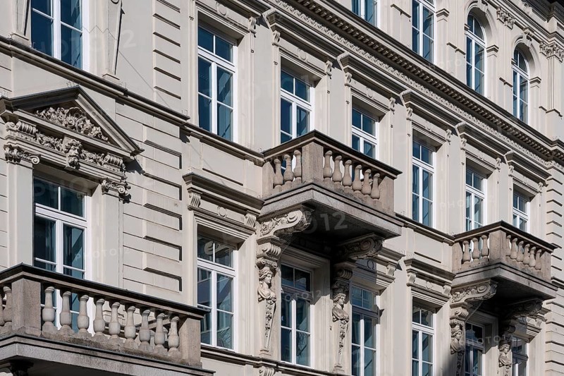 Classicist facade with balconies and caryatids