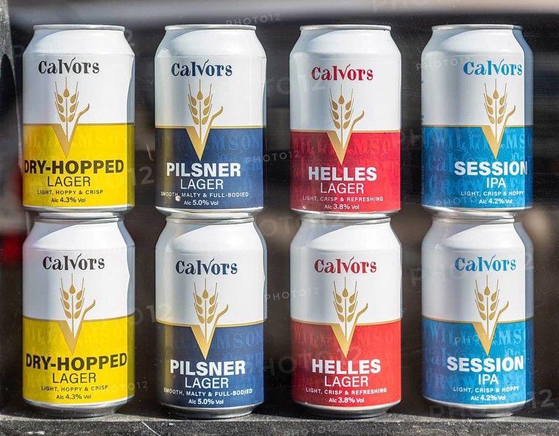 Shop window display of Calvors beer and lager cans