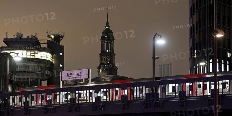 Baumwall underground station with the spire of St Michaelis church at night