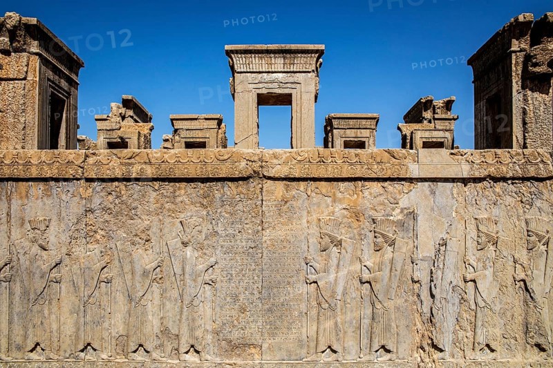 Persian guards at the west staircase of Darius Palace with cuneiform writing