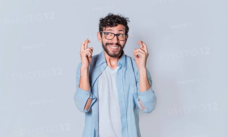 Happy man making a wish