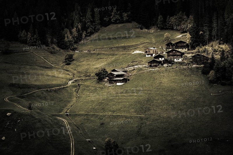Old farms on mountain meadow