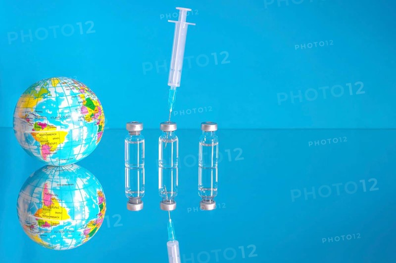 Vaccine bottles and syringe