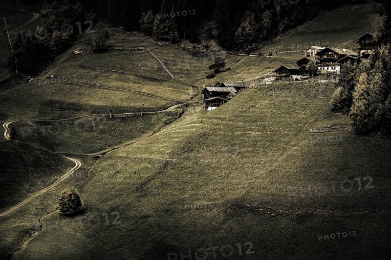 Old farms on mountain meadow