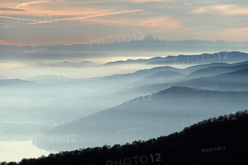 View from Pizzoni di Laveno on silhouettes of mountain ranges with Monte Viso in the distance