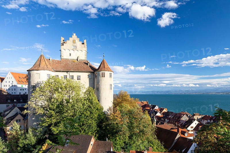 Meersburg Castle in the sunshine with a view of the Alps