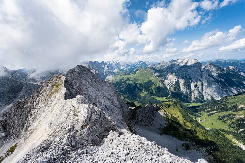 View from the summit of Lamsenspitze over rocky ridge to Schafkarspitze