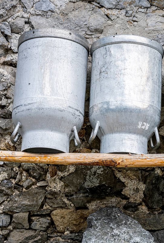 Milk cans at an alpine pasture in the Eng