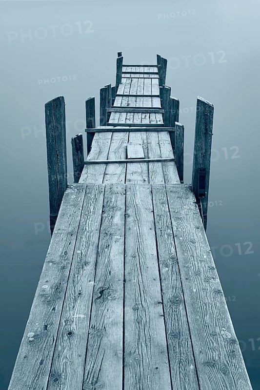 Jetty at Diessen am Lake Ammer with fog