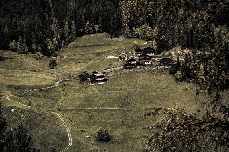 Old farms on mountain meadow