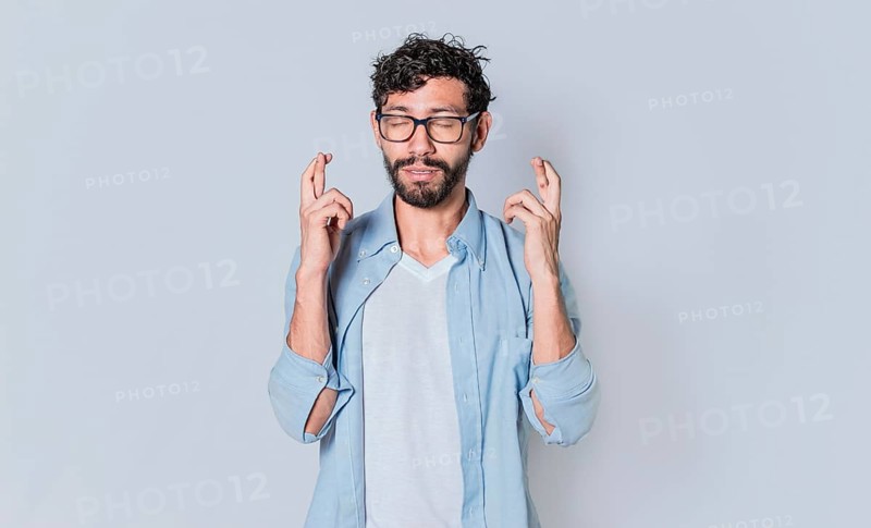 Happy man making a wish