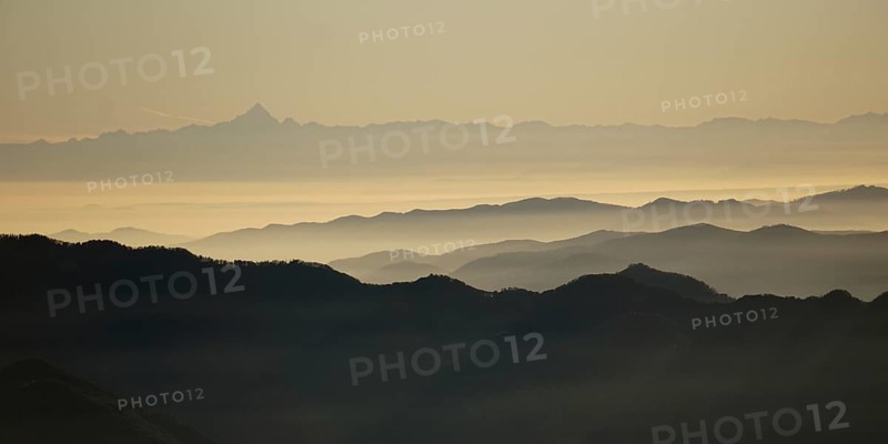 View from Pizzoni di Laveno on silhouettes of mountain ranges with Monte Viso in the distance