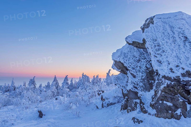 Snow Covered Winter Landscape with Rock at Dawn. Grosser Feldberg