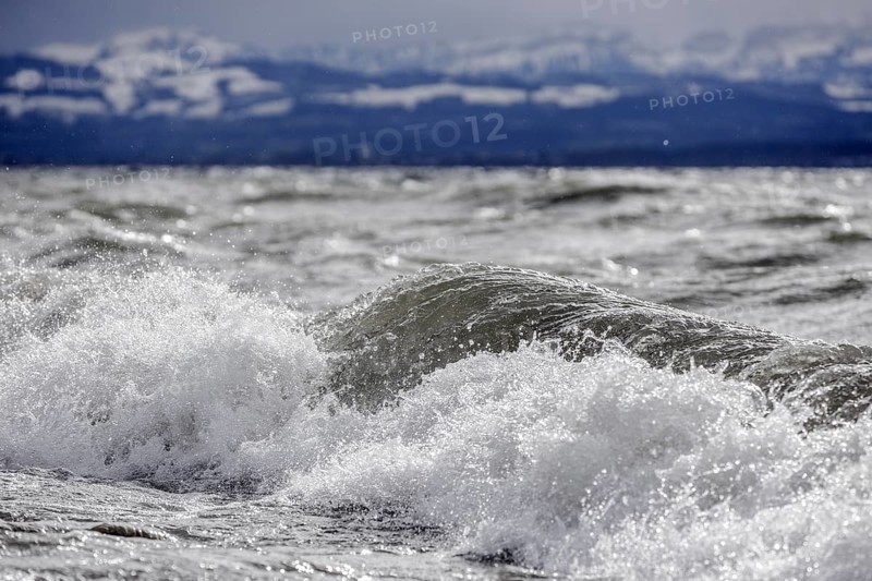 Storm Lolita raging on the rocky shore with waves in Hagnau