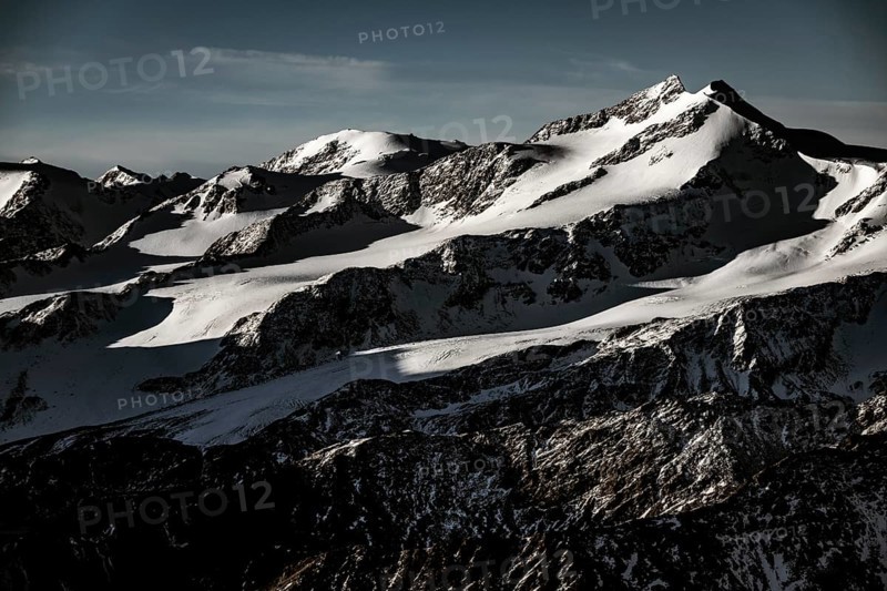 Snowy summit of Monte Cevedale at blue hour