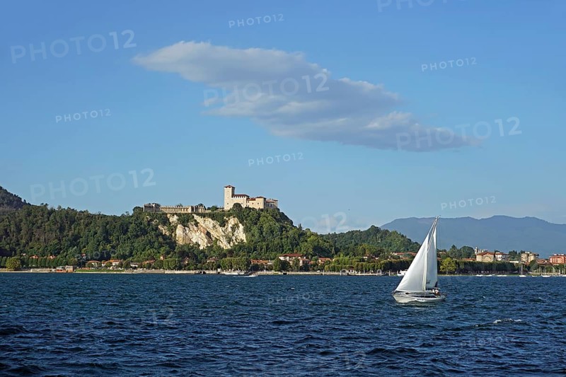 Sailing boat and castle of Angera or Rocca Borromeo di Angera