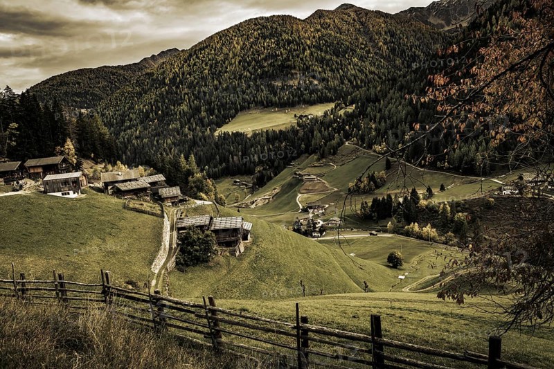 Old farms on mountain meadow