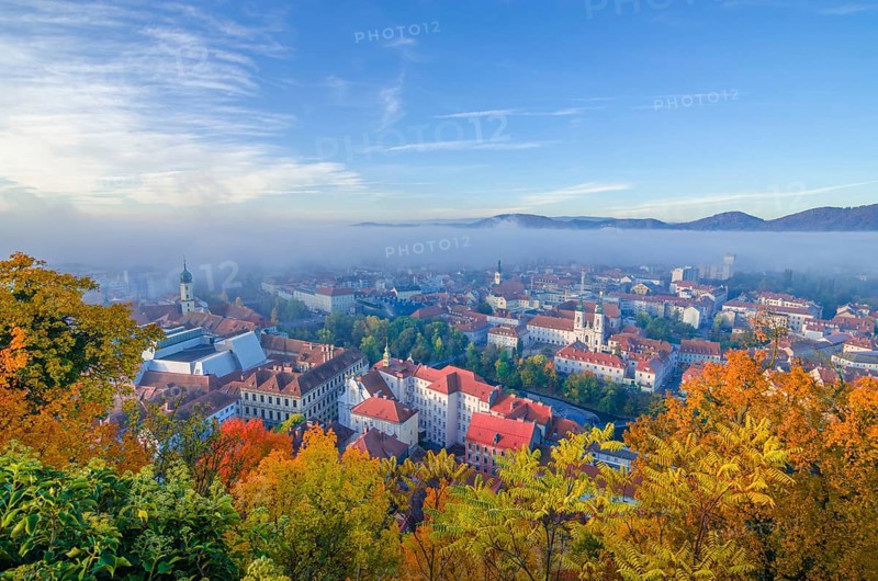 Cityscape of Graz with Mur river and Mariahilfer church