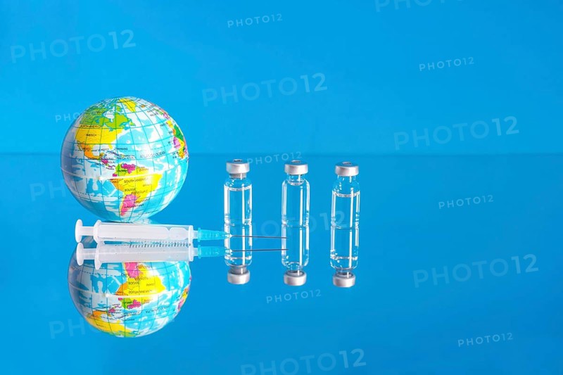Vaccine bottles and syringe