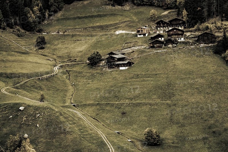 Old farms on mountain meadow