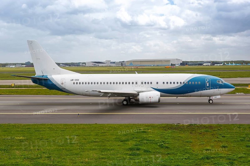 A Jonika Airlines Boeing 737-400 aircraft with registration UR-CSV at the airport in Amsterdam