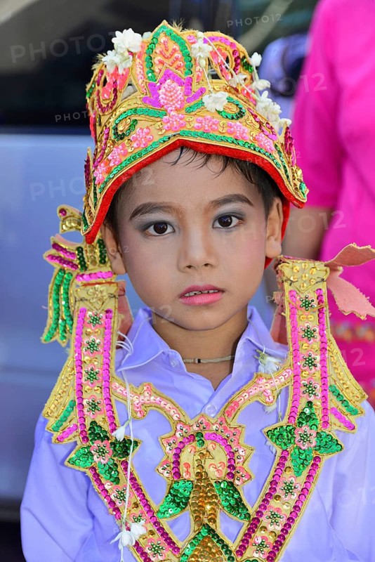 Splendidly dressed aspiring novice at novice ceremony