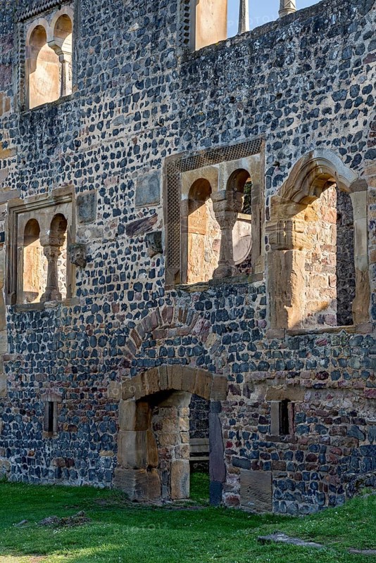 Facade of the Romanesque Muenzenberg Palas with windows and arcades
