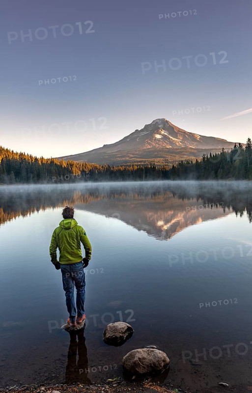 Young man standing on stone