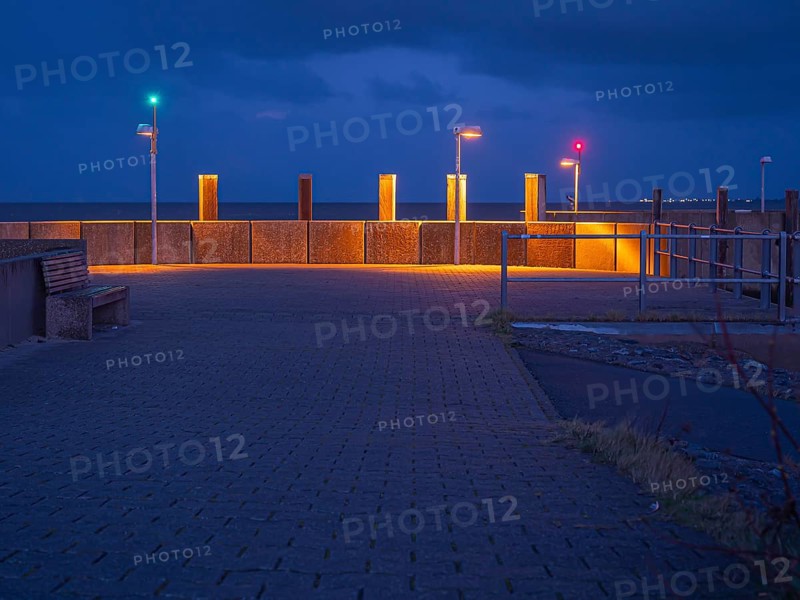 Harbour entrance with position lights in the evening at blue hour