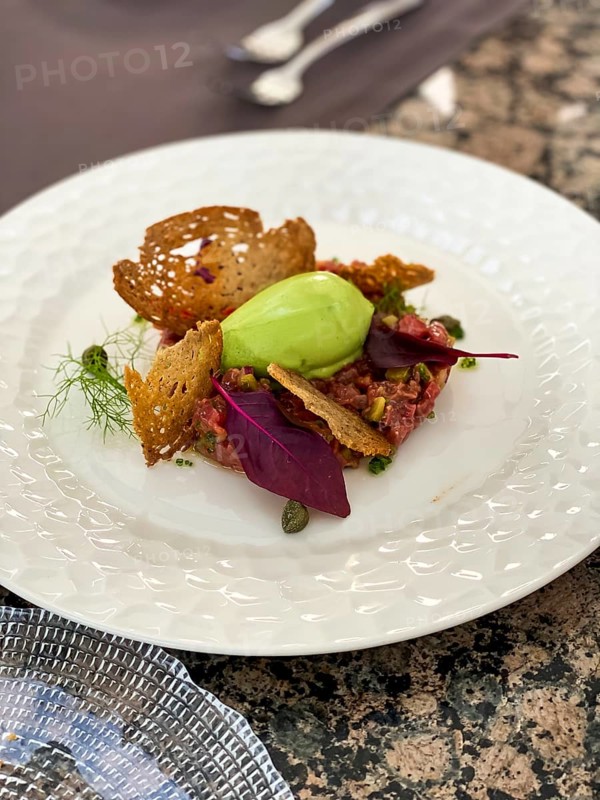 Avocado dip with toasted bread and salmon tartare