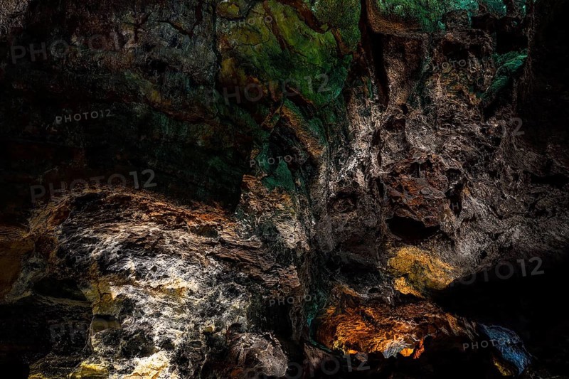 Colourfully illuminated areas of the Cueva de los Verdes