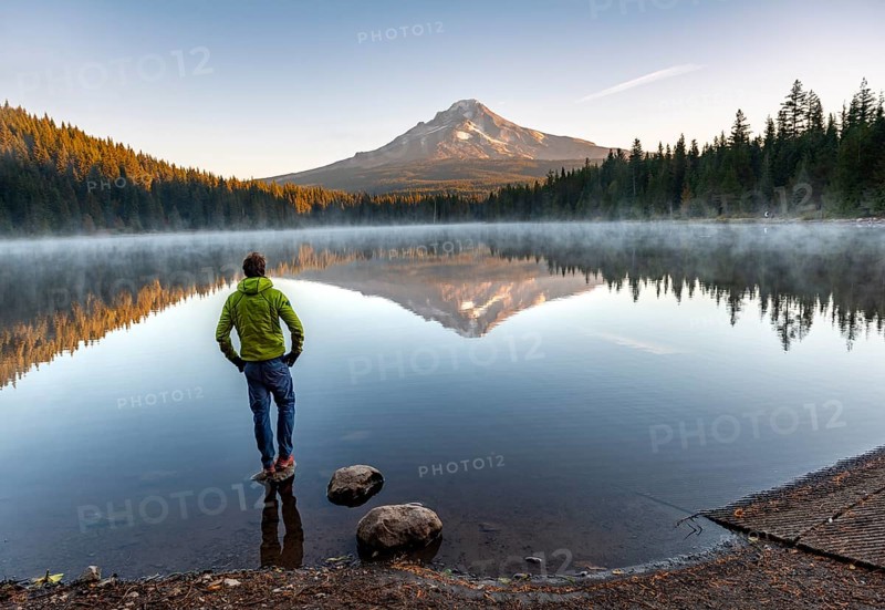 Young man standing on stone