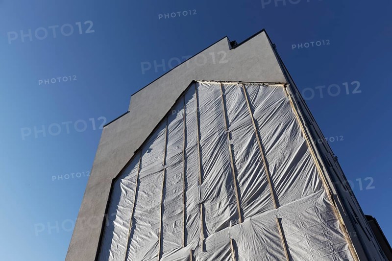 Fire wall with outline of a demolished house