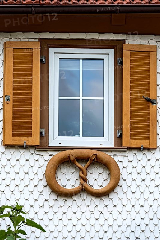 Residential house with wooden shingles as facade