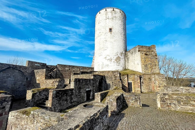 Ruin of foundation walls in former courtyard of Reifferscheid Castle in Eifel