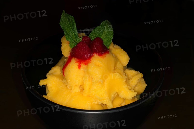 Mango sorbet with raspberries and fresh mint
