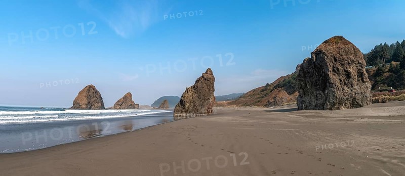 Sandy beach beach with sea and big rocks