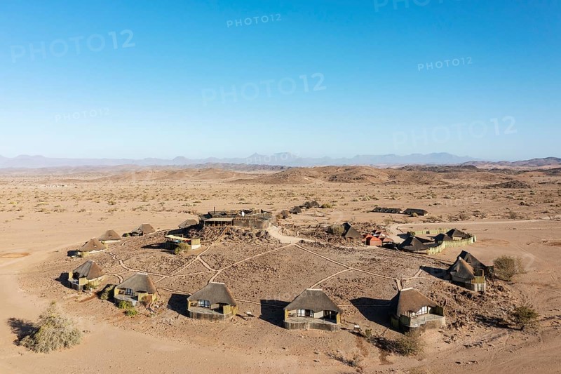 The Doro Nawas Camp and arid desert plains at the edge of the dry river bed of the Aba-Huab river