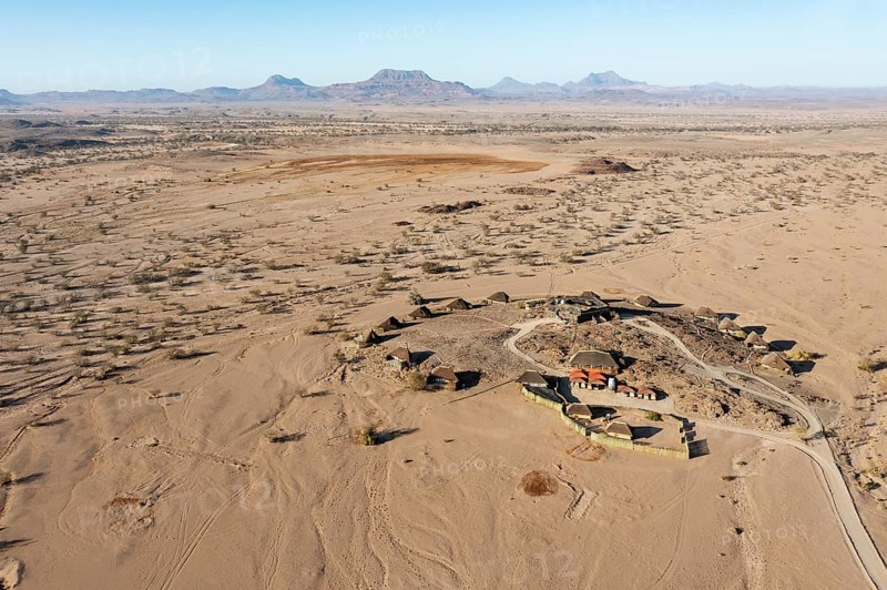 The Doro Nawas Camp and arid desert plains at the edge of the dry river bed of the Aba-Huab river