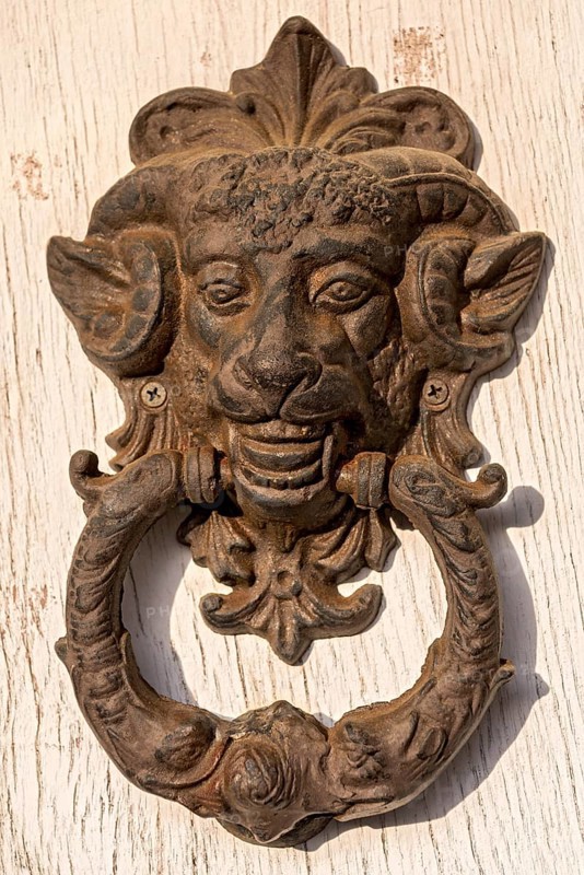Rusty old iron door knocker