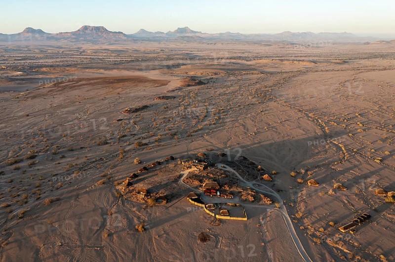 The Doro Nawas Camp and arid desert plains at the edge of the dry river bed of the Aba-Huab river