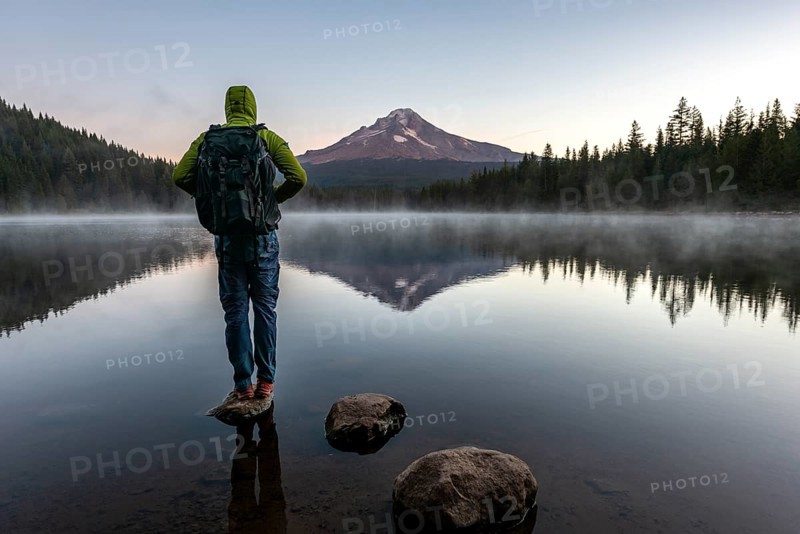 Young man standing on a stone