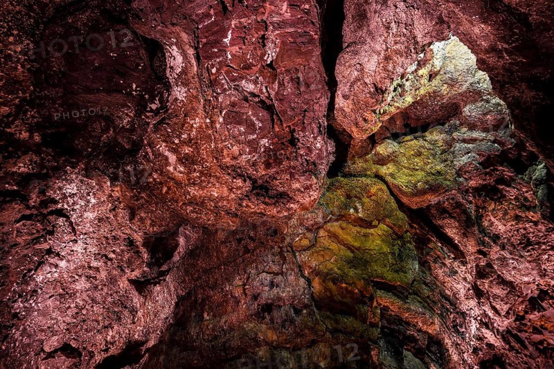 Colourfully illuminated areas of the Cueva de los Verdes