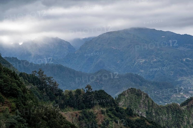 Mountain landscape with low clouds near Porto da Cruz
