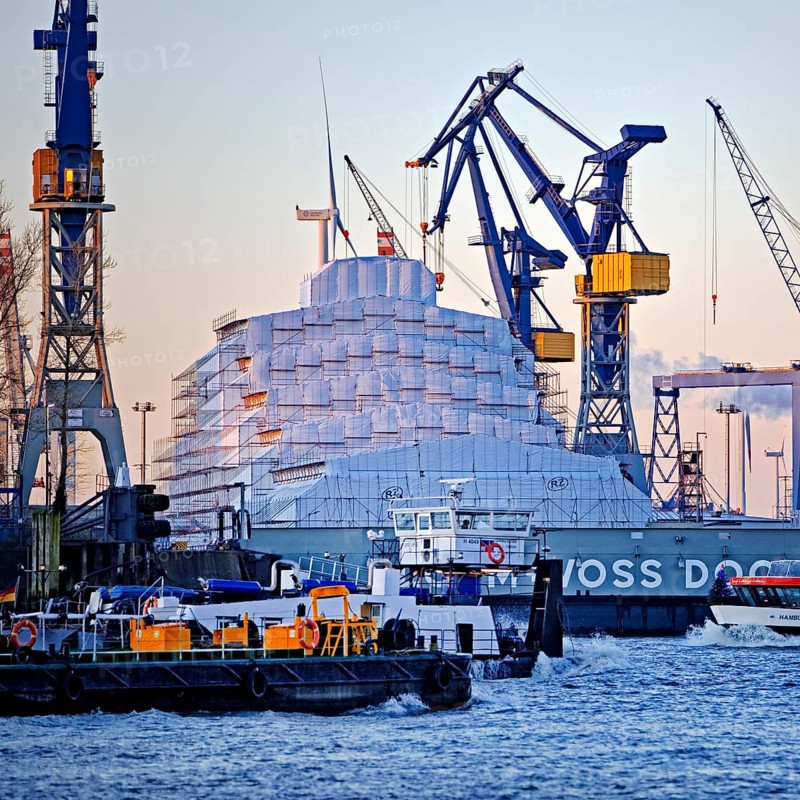 Dry dock Elbe 17 by Blohm and Voss with cranes and shipping traffic on the Norderelbe
