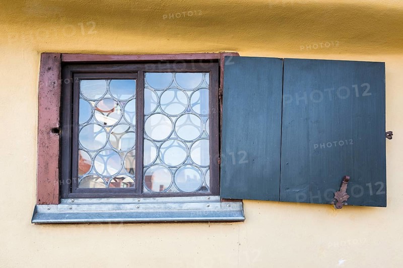 Window with leaded glass and crooked shutter at the house where Johann Sebastian Bach was born